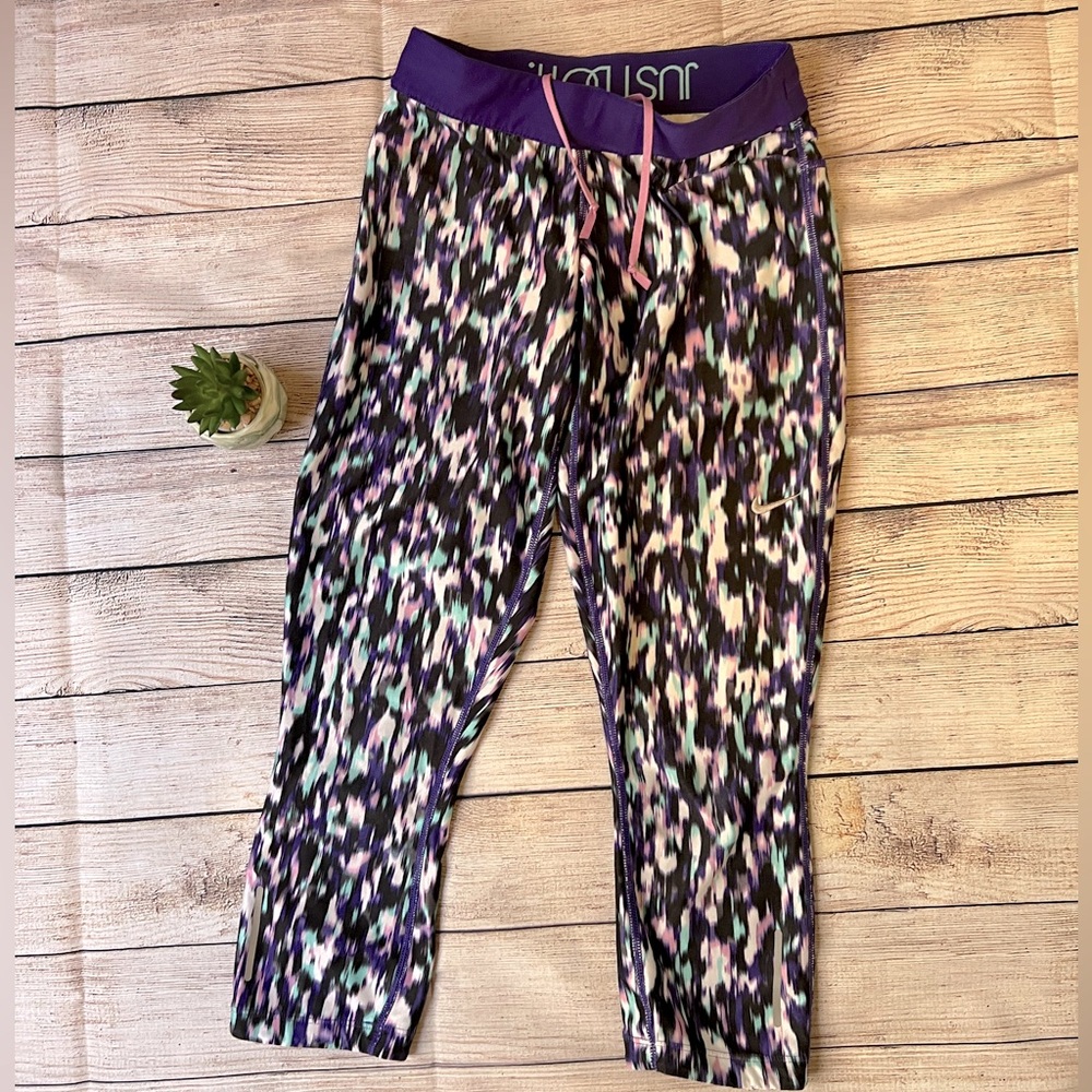 NIKE XS purple pattern Dri Fit runners.